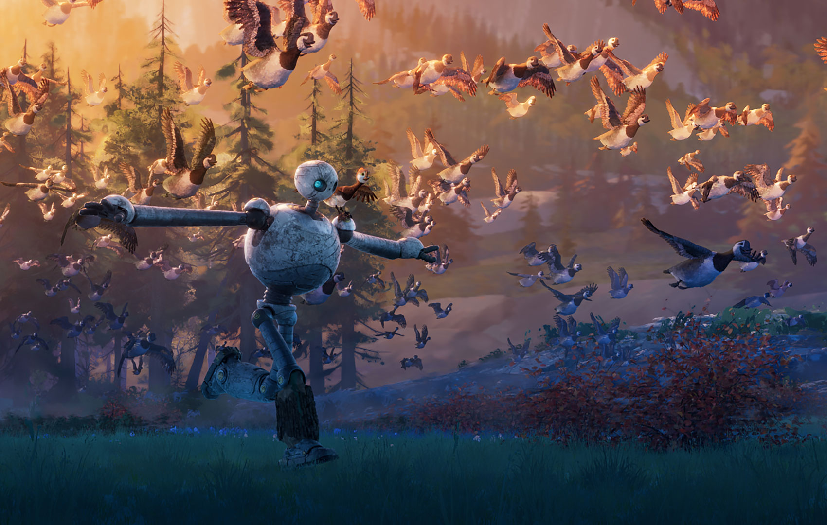 Ein kugeliger Roboter mit langen dünnen Armen und Beinen rennt über eine Wiese. Um ihn herum fliegt ein Schwarm Gänse. Er hat die Arme so ausgestreckt, als seinen es Flügel und er würde mit den Gänsen fliegen.